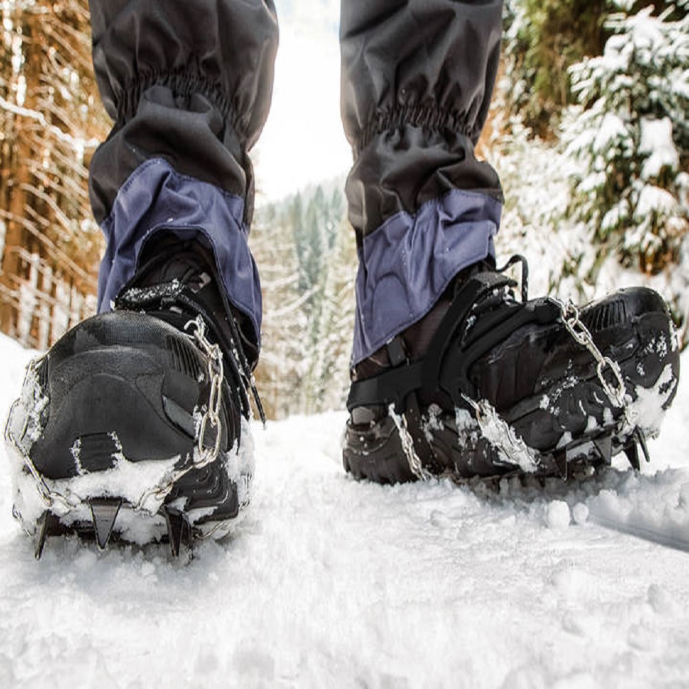 Crampons on hiking boot. Hiking in winter