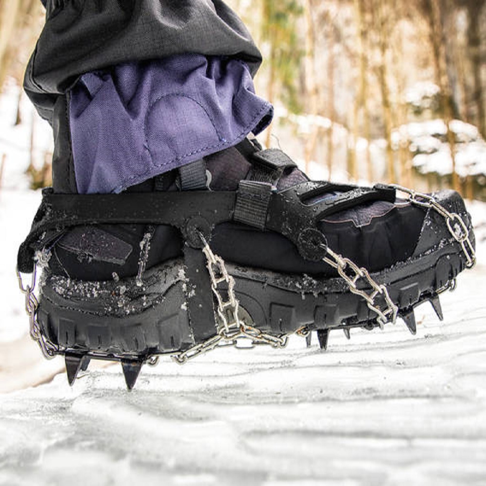 Crampons on hiking boot. Hiking in winter